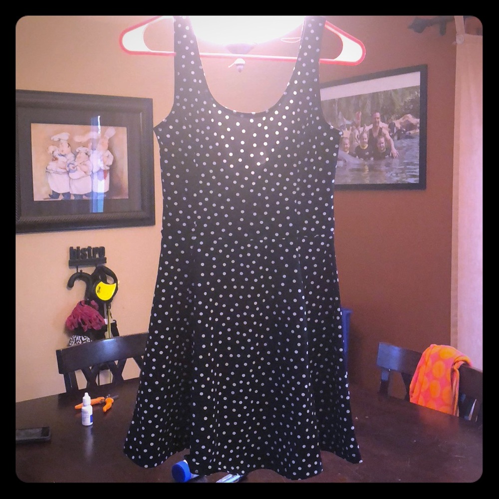 Black mini dress with white polka dots.